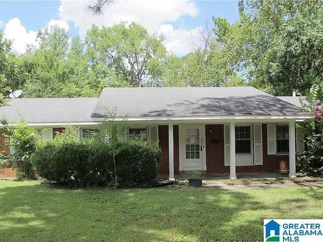 2131 Beverly Dr, Montgomery, AL 36111 - ranch-style house featuring a front yard, a porch, and brick siding