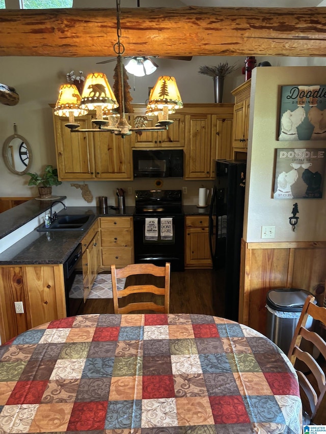 26718 Bridge Ln, Andalusia, AL 36421 - kitchen featuring black appliances, beamed ceiling, a chandelier, dark countertops, and decorative light fixtures