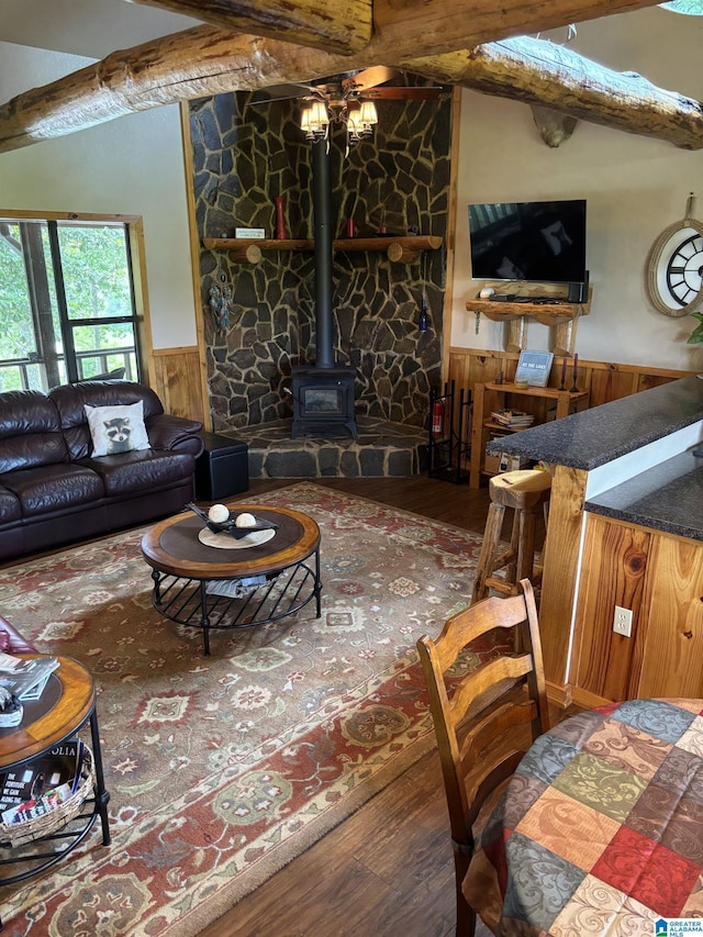 26718 Bridge Ln, Andalusia, AL 36421 - living room with a wainscoted wall, a wood stove, wood finished floors, and wood walls