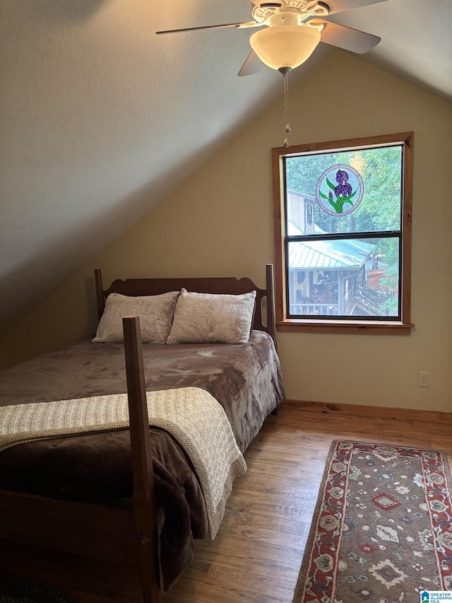 26718 Bridge Ln, Andalusia, AL 36421 - bedroom featuring wood finished floors, lofted ceiling, and ceiling fan