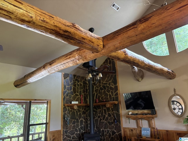 26718 Bridge Ln, Andalusia, AL 36421 - detailed view of beam ceiling, a wood stove, and wainscoting