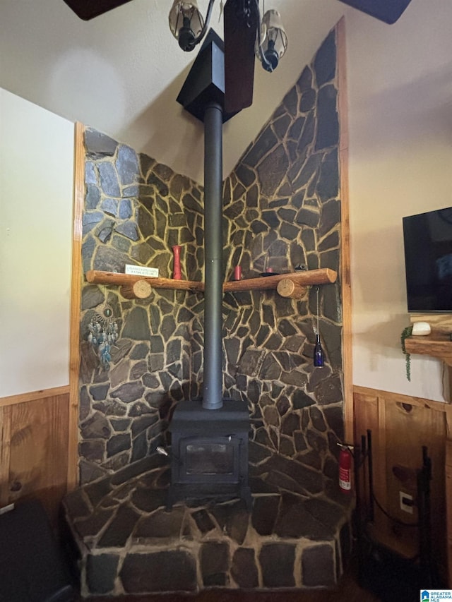 26718 Bridge Ln, Andalusia, AL 36421 - detailed view of wainscoting, a wood stove, and wooden walls