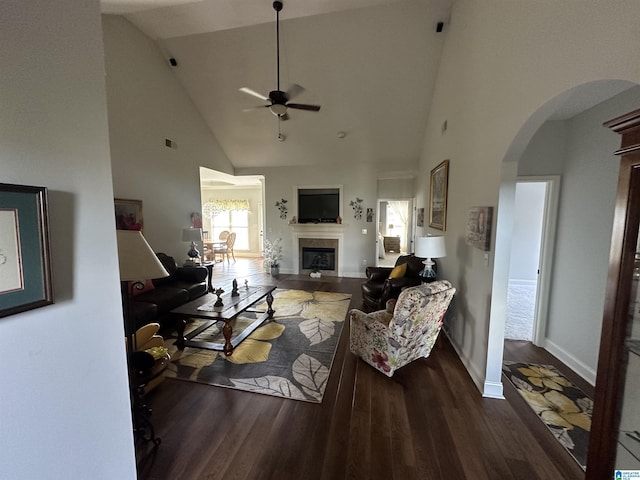 2007 Discovery Dr, Montevallo, AL 35115 - living area featuring arched walkways, ceiling fan, high vaulted ceiling, a glass covered fireplace, and wood finished floors