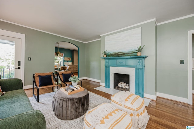 5100 7th Ct S, Birmingham, AL 35212 - living area featuring wood finished floors, healthy amount of natural light, and crown molding