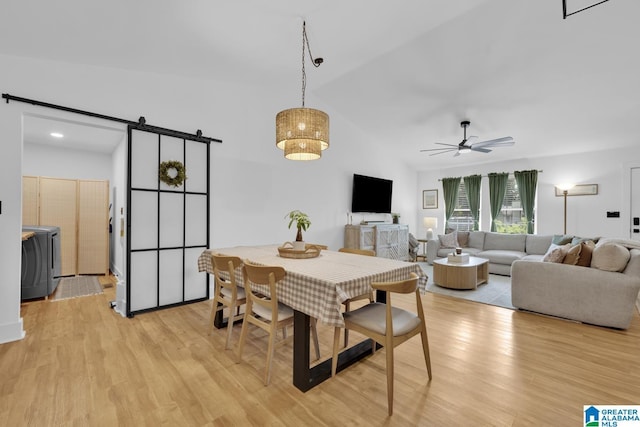 6400 Glenview Cir, Gardendale, AL 35071 - dining room with a barn door, a ceiling fan, light wood-type flooring, and vaulted ceiling
