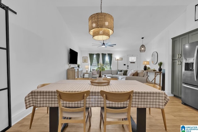 6400 Glenview Cir, Gardendale, AL 35071 - dining area with a chandelier, light wood finished floors, a ceiling fan, and vaulted ceiling