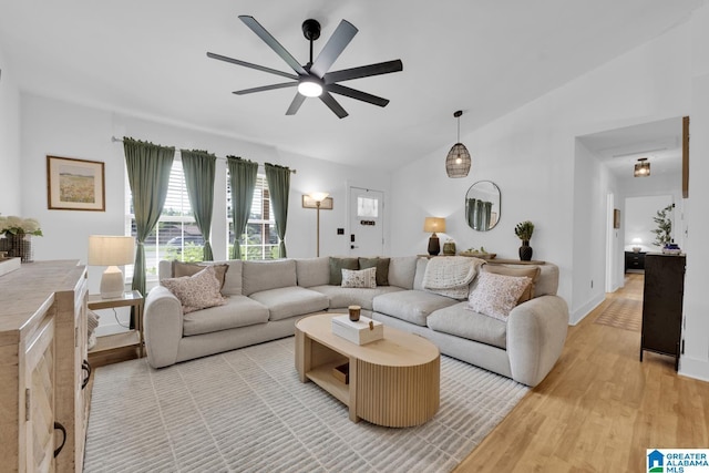 6400 Glenview Cir, Gardendale, AL 35071 - living room featuring vaulted ceiling, a ceiling fan, and light wood-style flooring