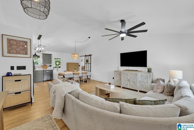 6400 Glenview Cir, Gardendale, AL 35071 - living room with a chandelier, light wood finished floors, ceiling fan, and vaulted ceiling