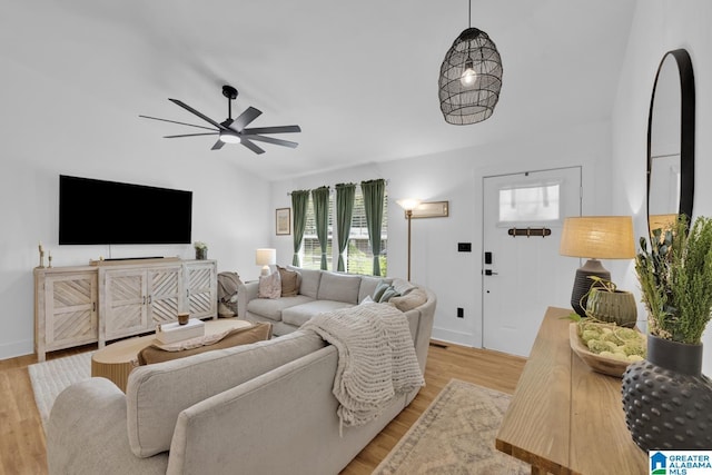 6400 Glenview Cir, Gardendale, AL 35071 - living area with vaulted ceiling, light wood finished floors, and a ceiling fan