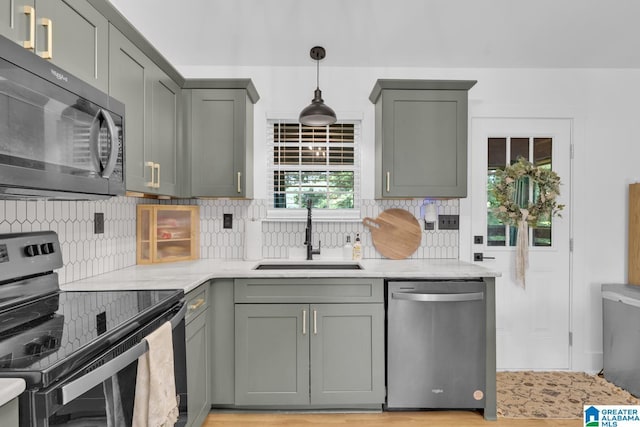 6400 Glenview Cir, Gardendale, AL 35071 - kitchen with black appliances, backsplash, hanging light fixtures, and light stone countertops