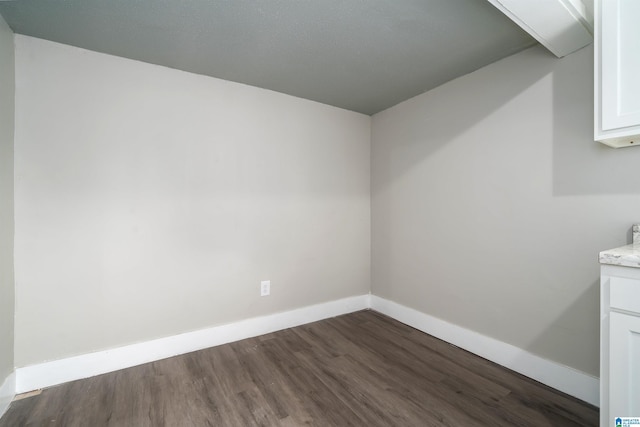 2129 Pike Rd, Birmingham, AL 35218 - washroom with dark wood-type flooring and baseboards