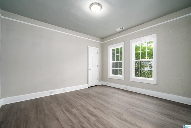 2129 Pike Rd, Birmingham, AL 35218 - empty room featuring wood finished floors and baseboards