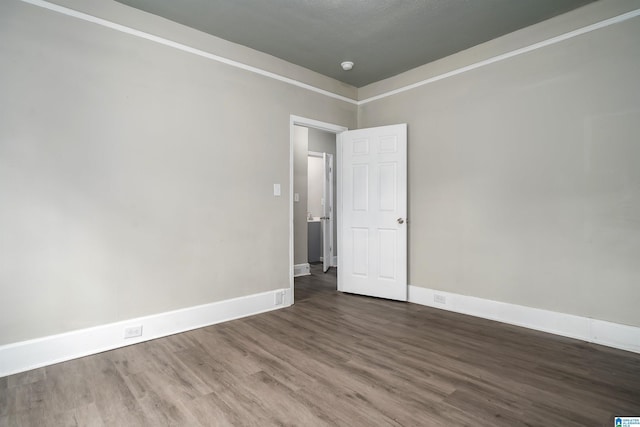 2129 Pike Rd, Birmingham, AL 35218 - unfurnished room with wood finished floors and a smoke detector