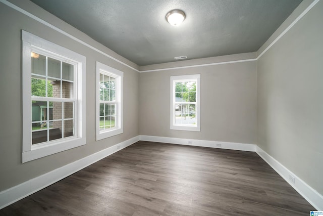 2129 Pike Rd, Birmingham, AL 35218 - empty room featuring dark wood-style floors and a textured ceiling