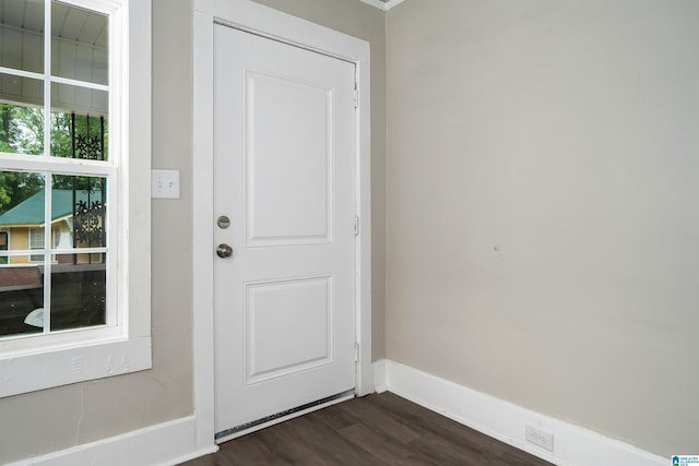 2129 Pike Rd, Birmingham, AL 35218 - doorway to outside with dark wood finished floors and baseboards