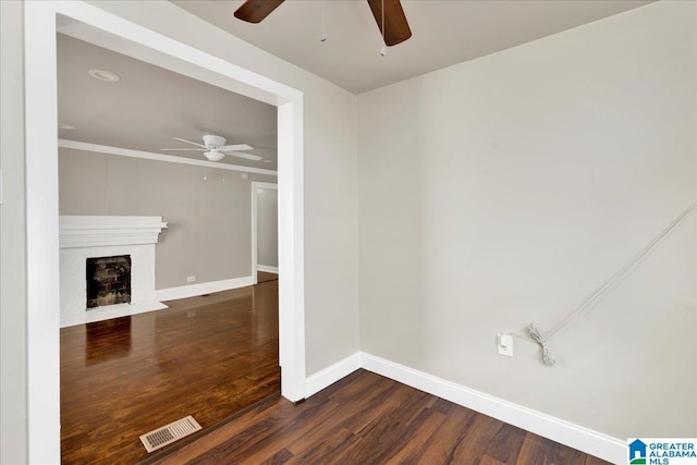 1125 SW 15th St, Birmingham, AL 35211 - unfurnished living room featuring ceiling fan, wood finished floors, a fireplace, and crown molding