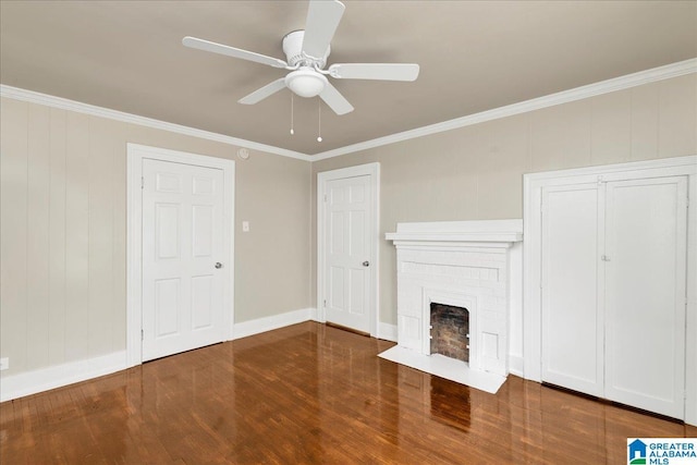 1125 SW 15th St, Birmingham, AL 35211 - unfurnished living room with wood finished floors, crown molding, a brick fireplace, and ceiling fan