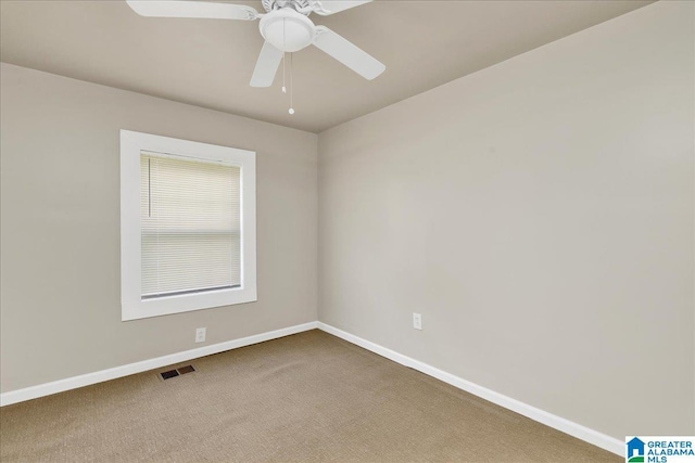1125 SW 15th St, Birmingham, AL 35211 - carpeted spare room with baseboards and a ceiling fan