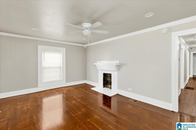 1125 SW 15th St, Birmingham, AL 35211 - unfurnished living room featuring a ceiling fan, wood finished floors, ornamental molding, and a brick fireplace