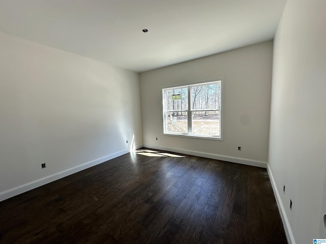 7733 Springer Rd, Mccalla, AL 35111 - empty room with dark wood finished floors and baseboards