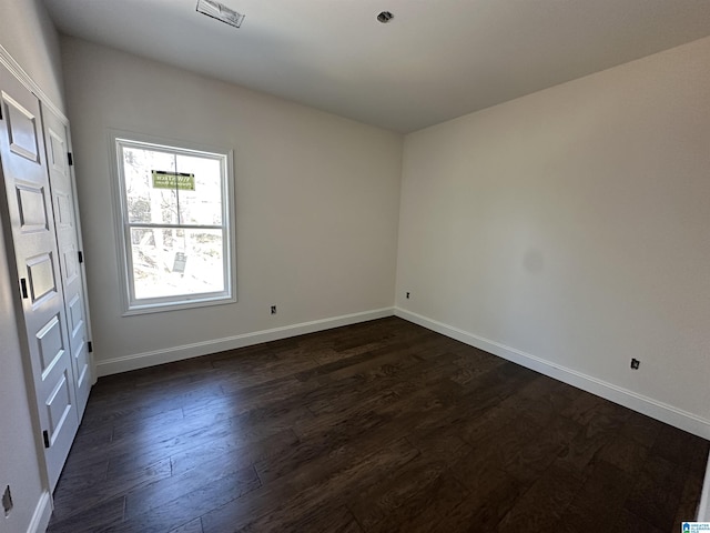 7733 Springer Rd, Mccalla, AL 35111 - empty room featuring dark wood finished floors and baseboards