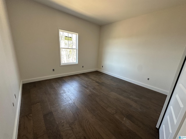 7733 Springer Rd, Mccalla, AL 35111 - empty room with dark wood-style flooring and baseboards