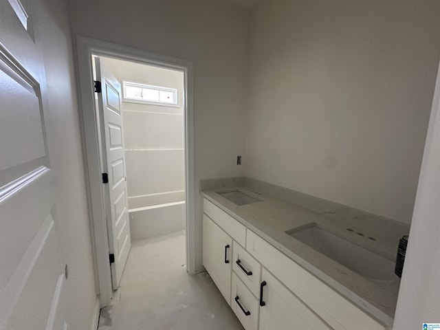 7733 Springer Rd, Mccalla, AL 35111 - full bathroom with double vanity and unfinished concrete flooring