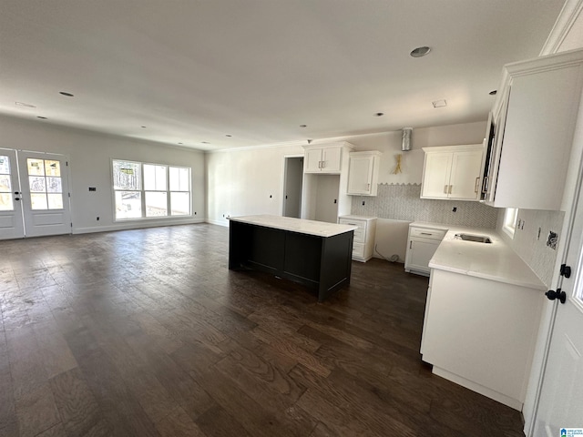 7733 Springer Rd, Mccalla, AL 35111 - kitchen featuring dark wood finished floors, backsplash, a kitchen island, white cabinets, and recessed lighting