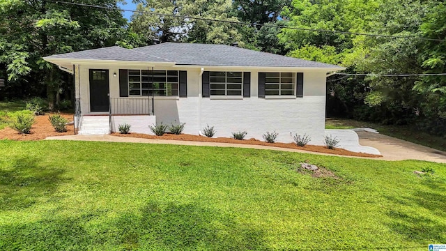 532 Hickory St, Birmingham, AL 35206 - view of front of property with a front yard, a porch, brick siding, and a shingled roof