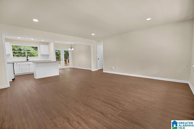 532 Hickory St, Birmingham, AL 35206 - unfurnished living room featuring french doors, dark wood-type flooring, and recessed lighting