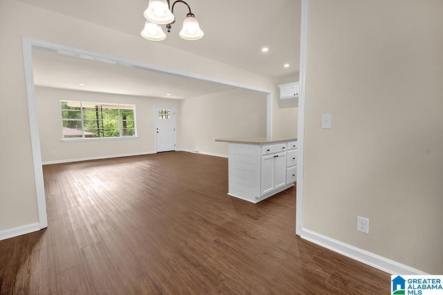 532 Hickory St, Birmingham, AL 35206 - spare room featuring a chandelier, dark wood-type flooring, and recessed lighting