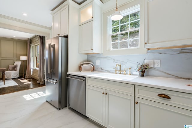 2719 Hanover Cir S, Birmingham, AL 35205 - kitchen with appliances with stainless steel finishes, crown molding, white cabinetry, light countertops, and pendant lighting
