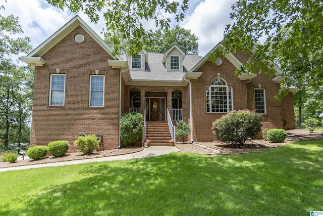 8587 Hayes Rd, Helena, AL 35022 - view of front of property featuring a front yard, brick siding, roof with shingles, and a porch