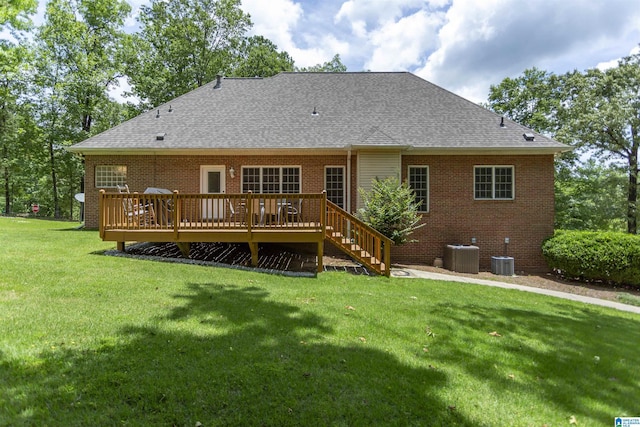 8587 Hayes Rd, Helena, AL 35022 - rear view of house featuring a shingled roof, a deck, a yard, and brick siding