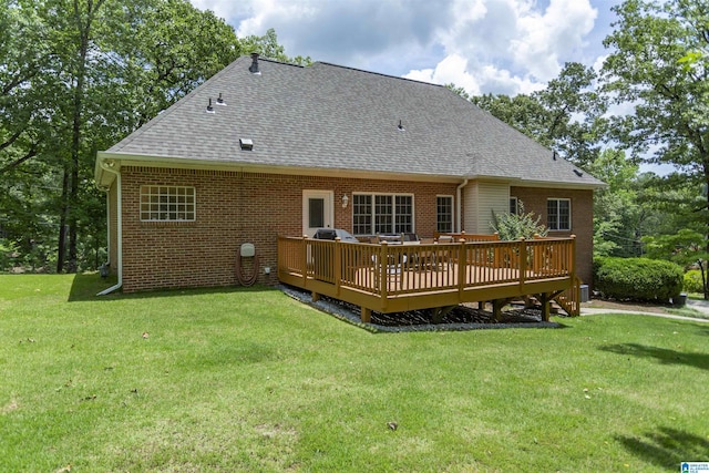 8587 Hayes Rd, Helena, AL 35022 - rear view of house with a shingled roof, a wooden deck, a lawn, and brick siding