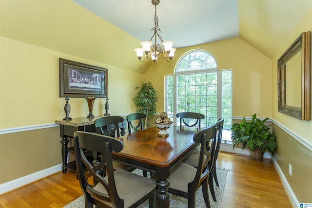8587 Hayes Rd, Helena, AL 35022 - dining space featuring lofted ceiling, light wood-style flooring, and a chandelier