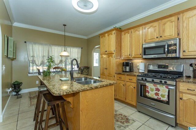 8587 Hayes Rd, Helena, AL 35022 - kitchen featuring stainless steel appliances, light tile patterned floors, dark stone counters, and crown molding