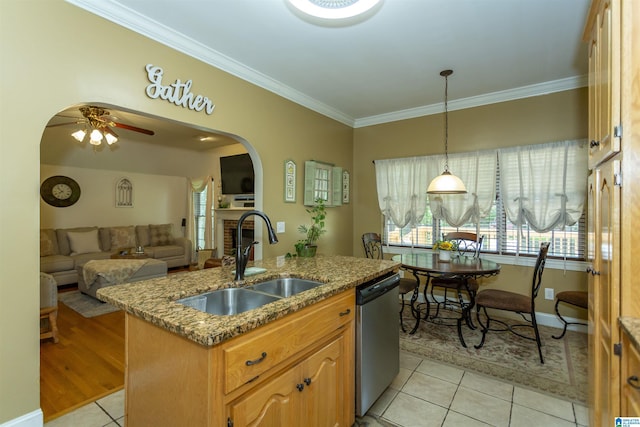 8587 Hayes Rd, Helena, AL 35022 - kitchen with stainless steel dishwasher, light tile patterned floors, crown molding, arched walkways, and ceiling fan