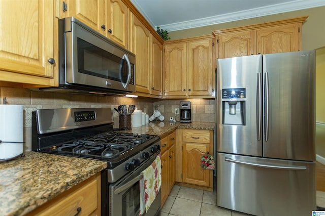 8587 Hayes Rd, Helena, AL 35022 - kitchen with appliances with stainless steel finishes, crown molding, light tile patterned flooring, tasteful backsplash, and stone counters