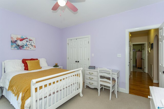 8587 Hayes Rd, Helena, AL 35022 - bedroom with a closet, light colored carpet, ceiling fan, and arched walkways