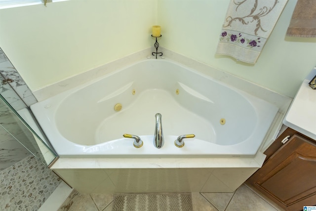 8587 Hayes Rd, Helena, AL 35022 - bathroom featuring a tub with jets and tile patterned floors