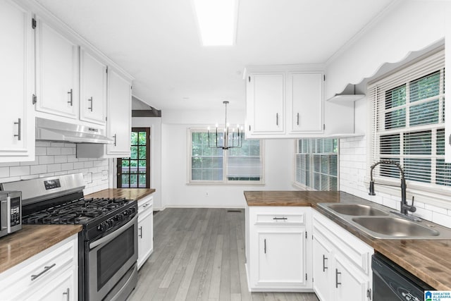2005 Crossvine Rd, Hoover, AL 35244 - kitchen with appliances with stainless steel finishes, under cabinet range hood, open shelves, wooden counters, and white cabinets