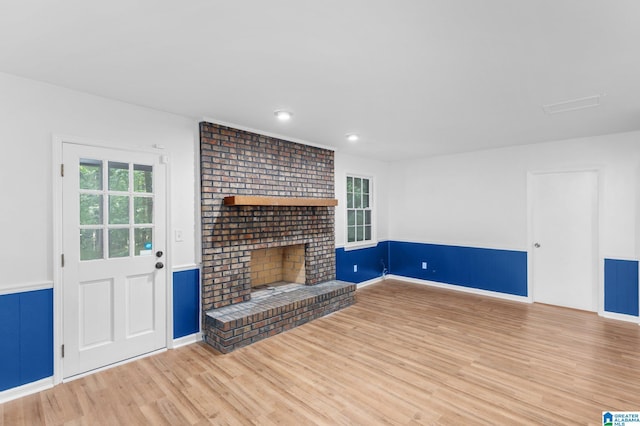 2005 Crossvine Rd, Hoover, AL 35244 - unfurnished living room featuring light wood-style floors, a fireplace, recessed lighting, and a wainscoted wall