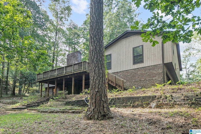 2005 Crossvine Rd, Hoover, AL 35244 - back of house with a wooden deck, brick siding, and stairway