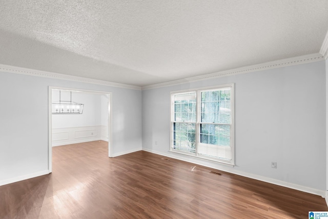 2005 Crossvine Rd, Hoover, AL 35244 - spare room with crown molding, wood finished floors, a textured ceiling, and a chandelier