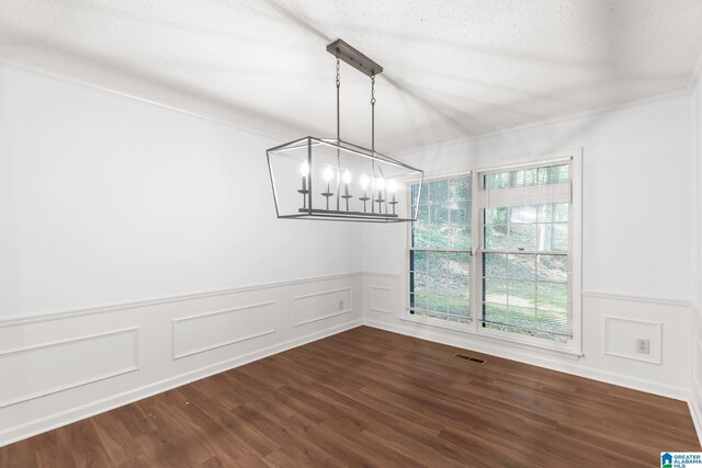 2005 Crossvine Rd, Hoover, AL 35244 - unfurnished dining area featuring a chandelier, wood finished floors, a decorative wall, and a wainscoted wall