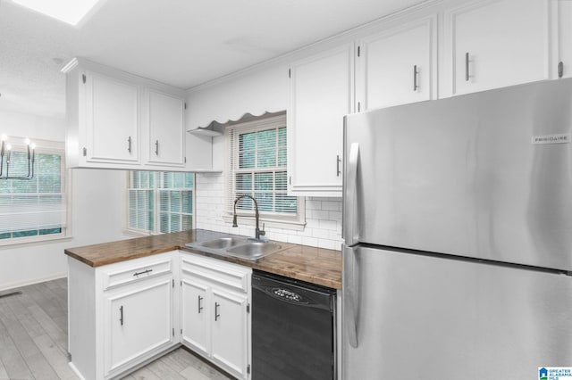 2005 Crossvine Rd, Hoover, AL 35244 - kitchen featuring freestanding refrigerator, black dishwasher, decorative backsplash, and wood counters