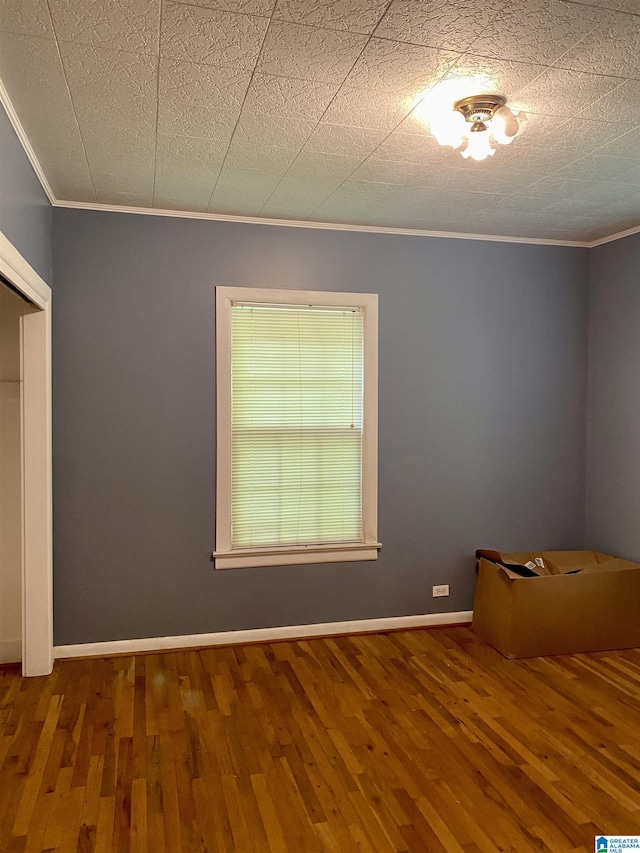 3185 Loblolly Ln, Birmingham, AL 35224 - unfurnished bedroom featuring ornamental molding and wood finished floors