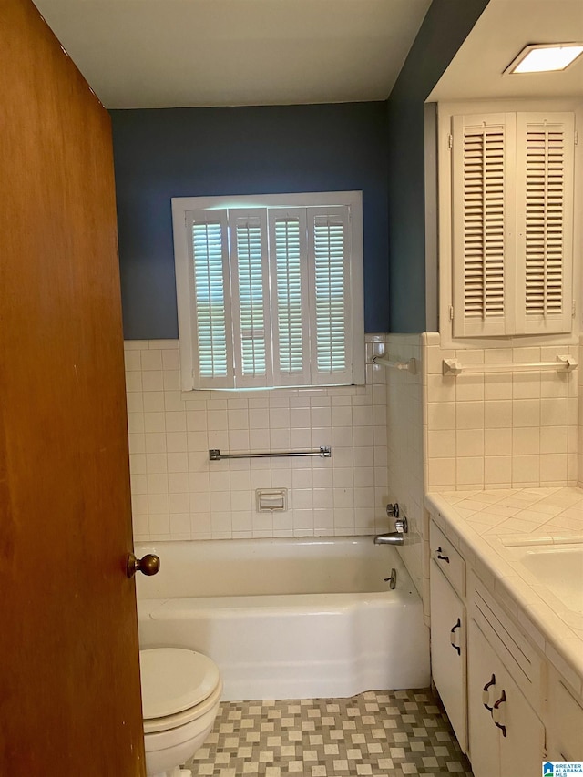 3185 Loblolly Ln, Birmingham, AL 35224 - full bathroom with a garden tub, vanity, wainscoting, and tile patterned floors