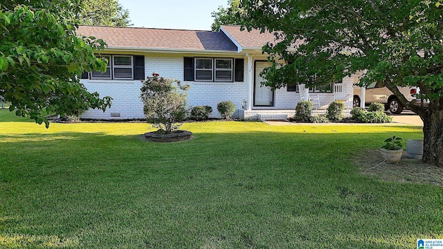 4 Carriage Rd, Anniston, AL 36206 - view of front of property featuring a front lawn and brick siding